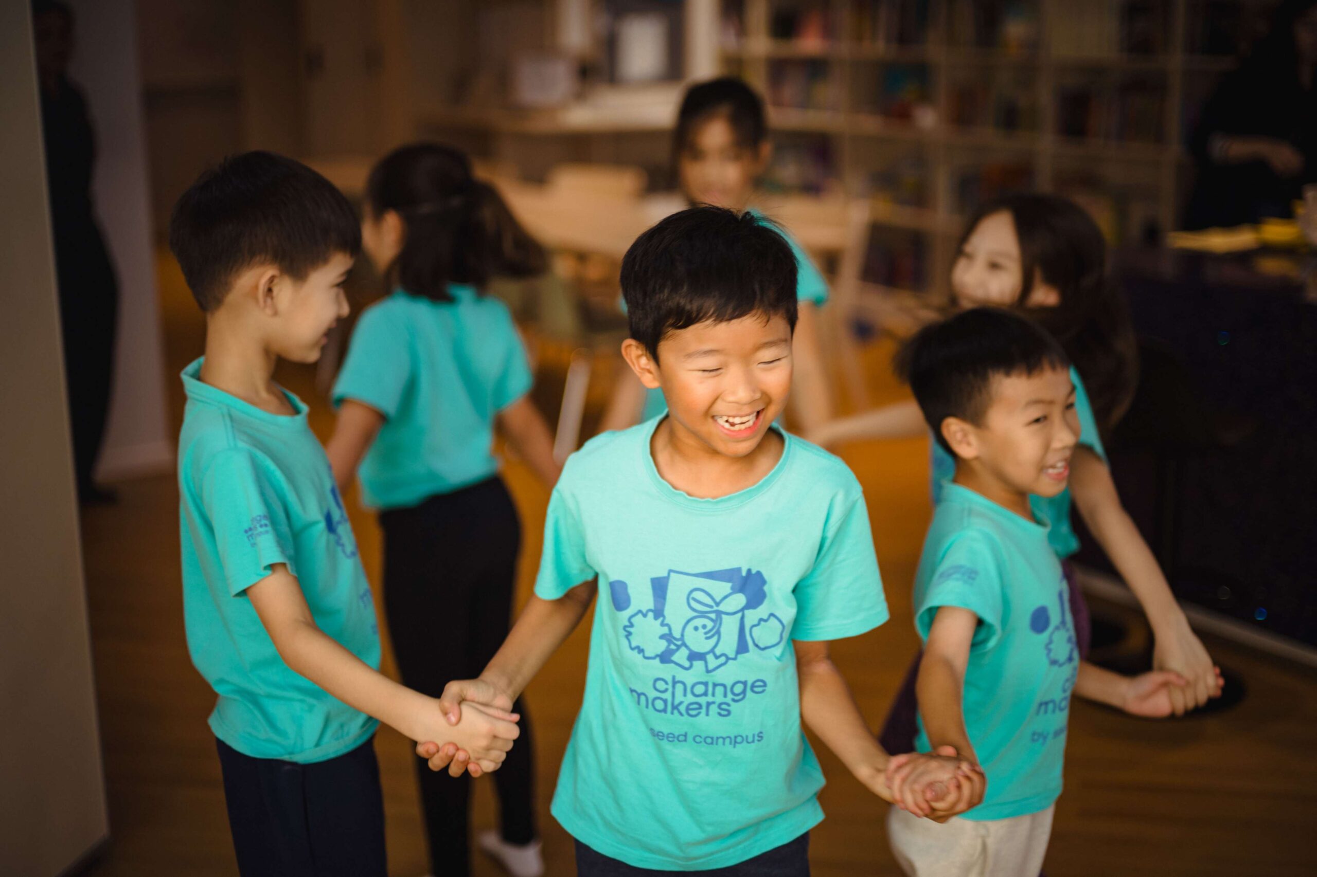 Children gathering around in a circle for group activity 